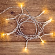 NEON-NIGHT Гирлянда светодиодная универсальная 10 LED, 1,2 метра, прозрачный ПВХ, теплое белое свечение, батарейки 2хАА 303-073
